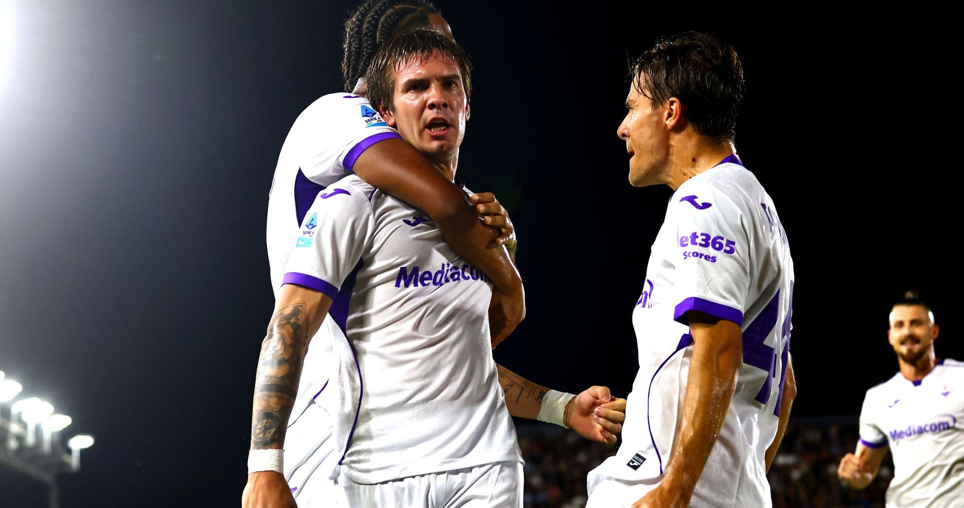 Fiorentina players celebrating a goal together