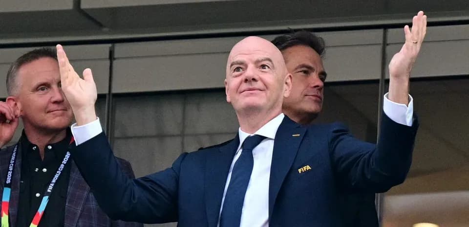 FIFA president gesturing in VIP box during event