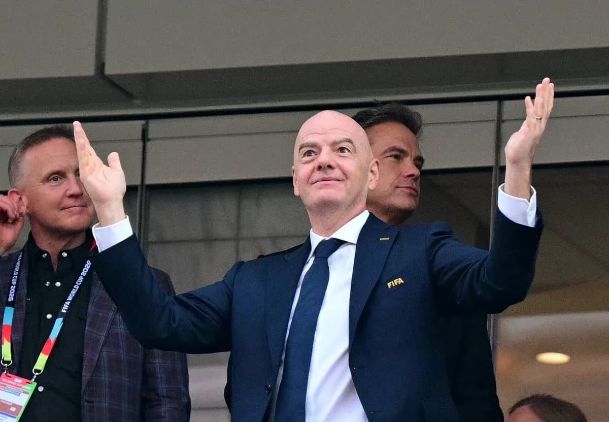 FIFA president gesturing in VIP box during event