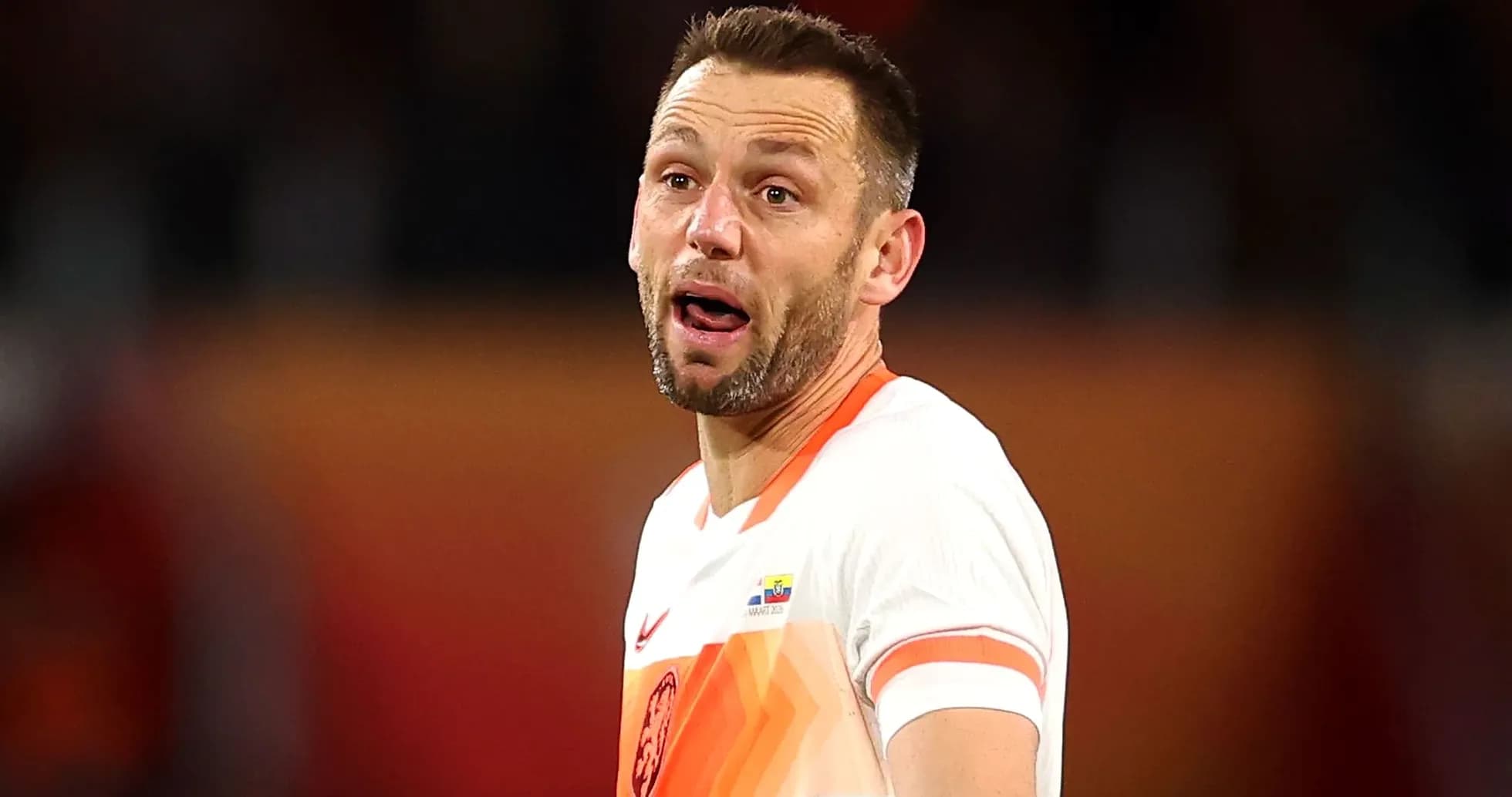 Player in national team jersey reacting during match
