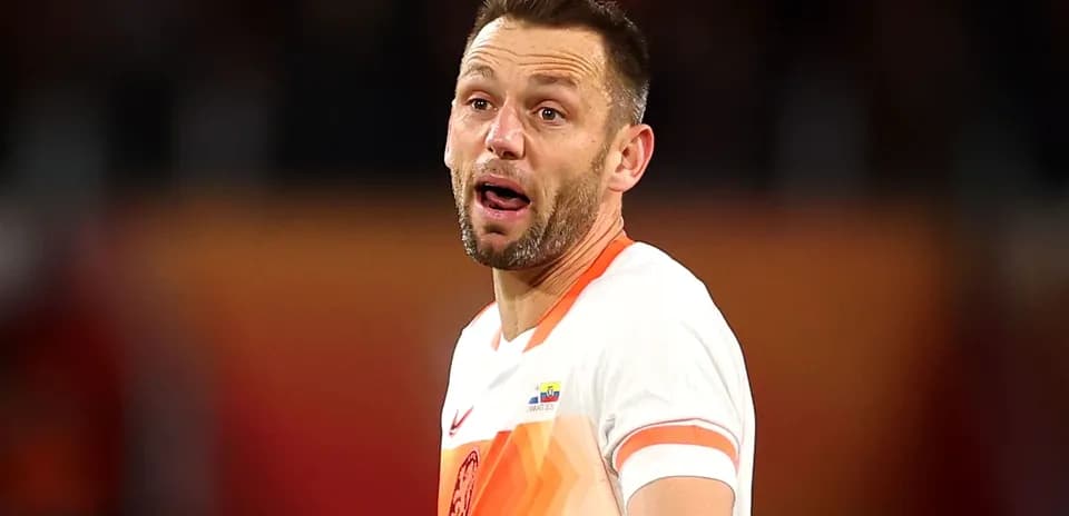 Player in national team jersey reacting during match