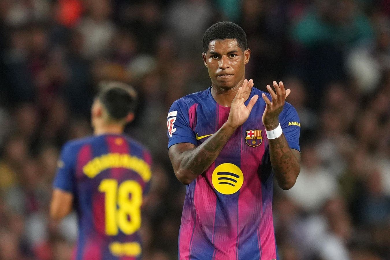 Player applauding during a Barcelona match