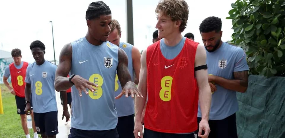 Players discussing during training session outdoors