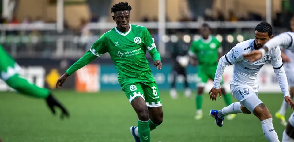 Player dribbling the ball during match action