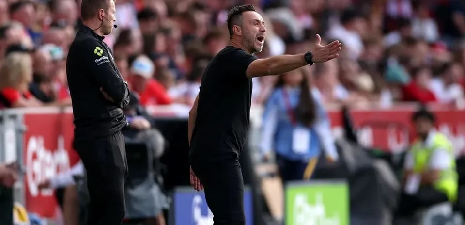 Coach gesturing during match from sideline