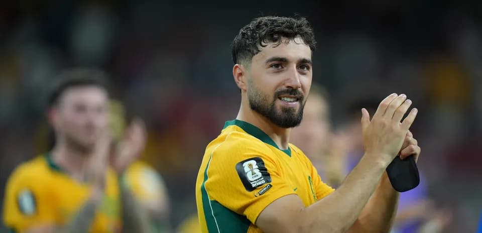 Player celebrating and applauding fans after match