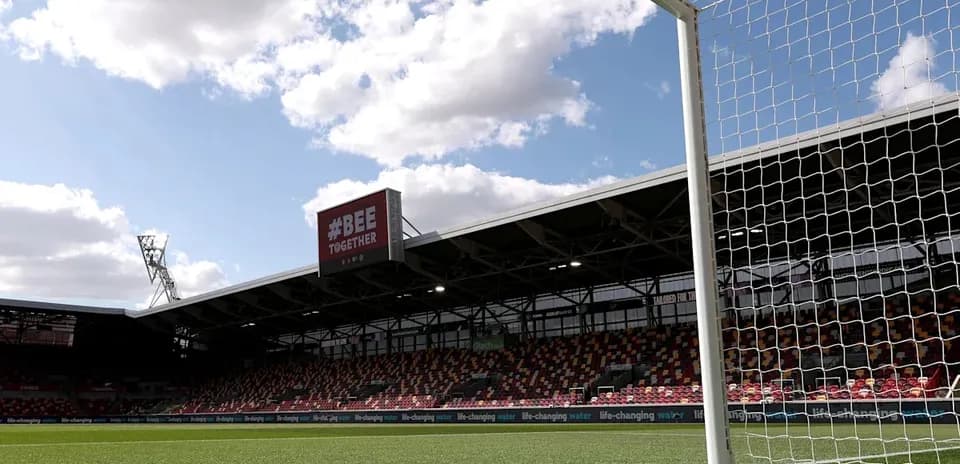 Goalpost with stadium seating in background