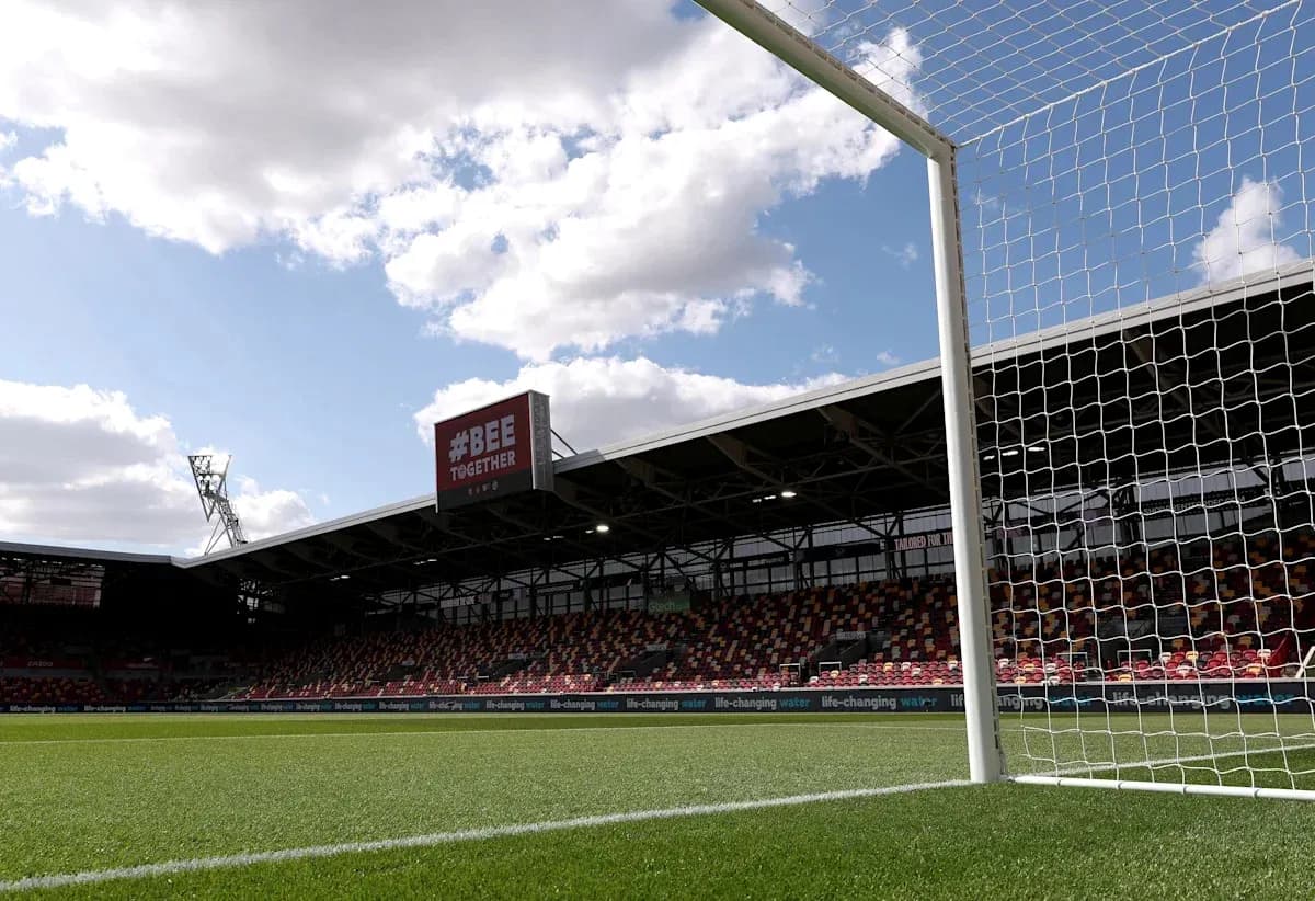 Goalpost with stadium seating in background
