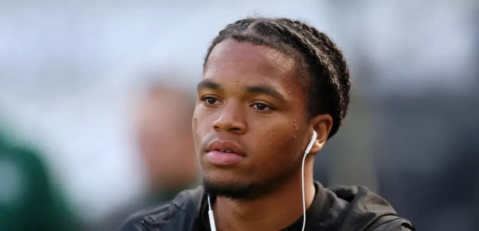 Player with headphones during warm-up session