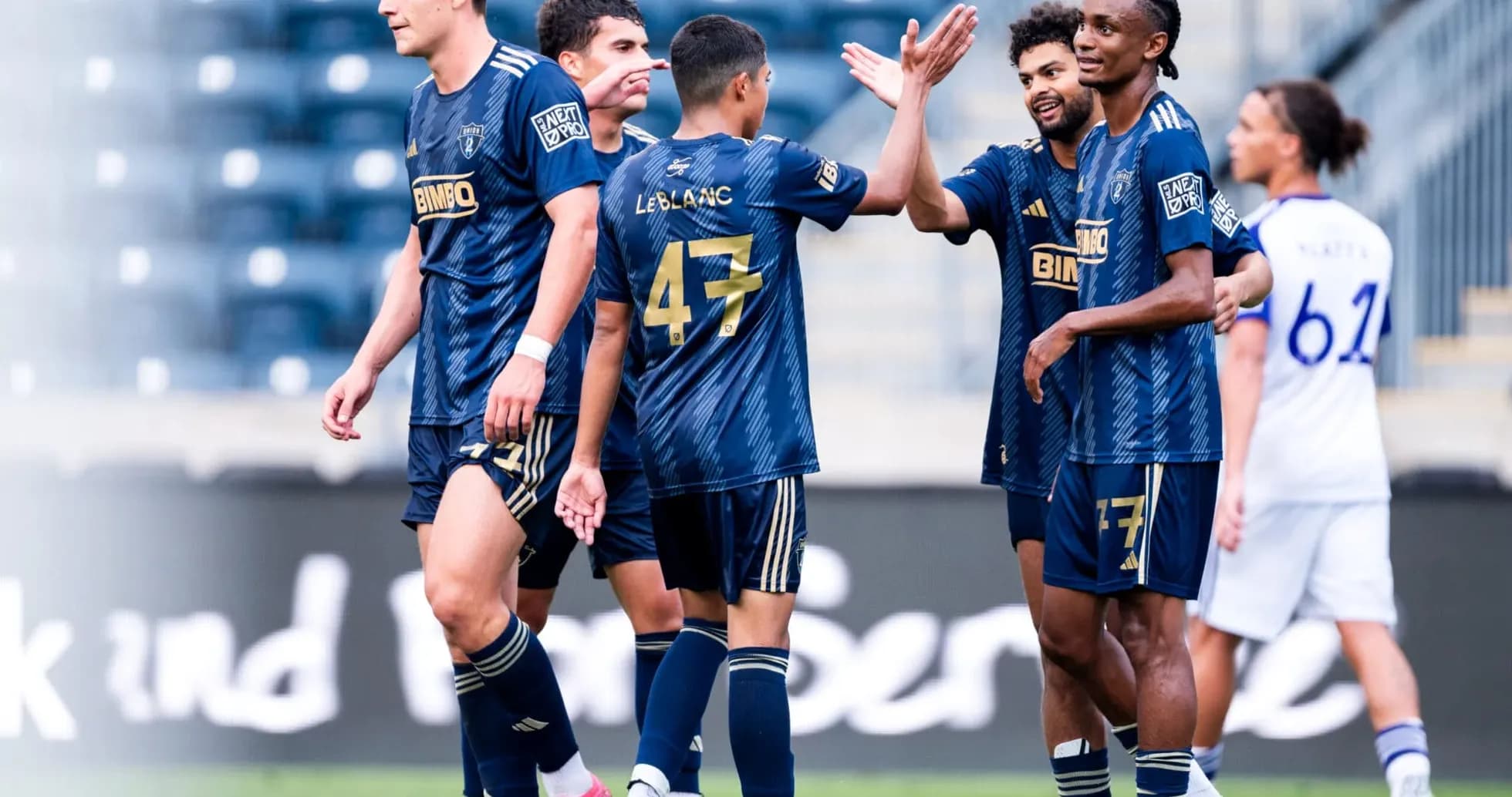 Players celebrating during MLS Next Pro match