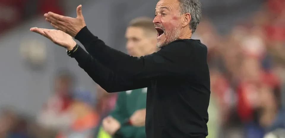 Coach gesturing during a match on the sidelines