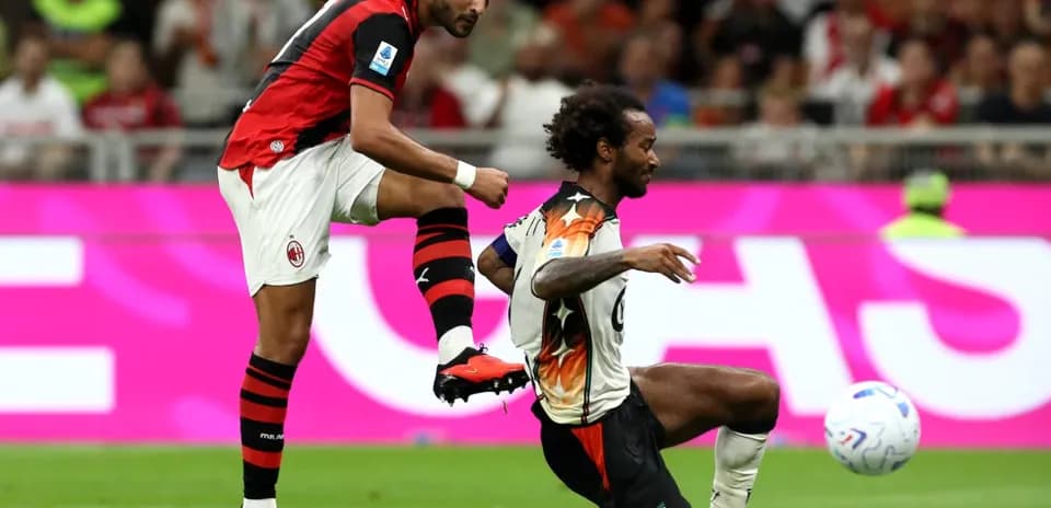 AC Milan player kicking the ball against Venezia