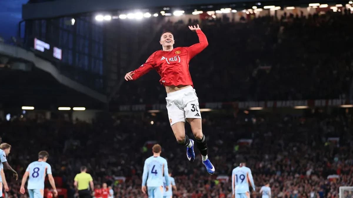 Manchester United player celebrating a goal at Old Trafford