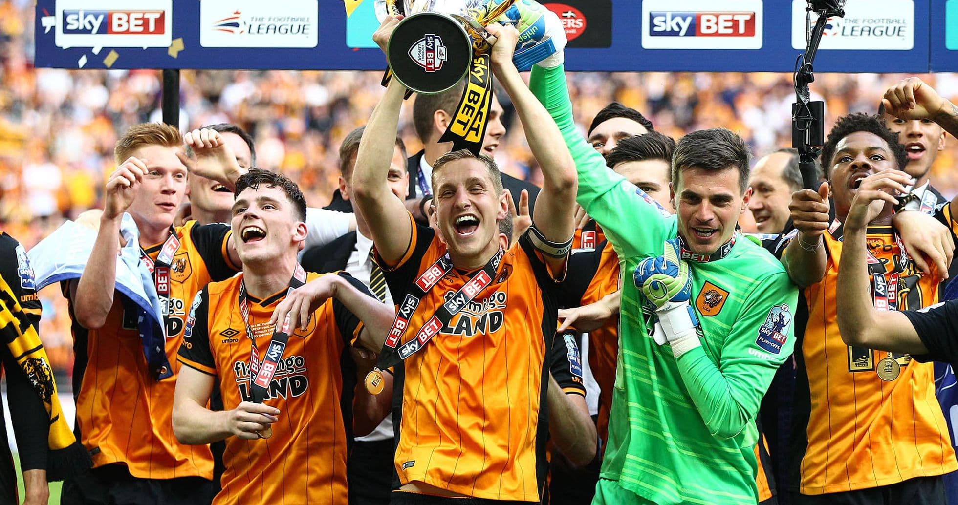 Hull City players celebrating with the trophy