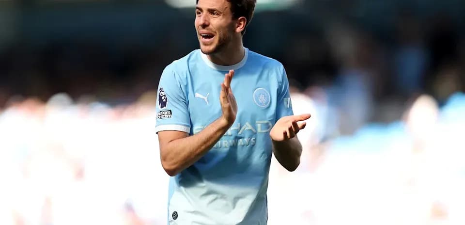 Player applauding fans during match at stadium