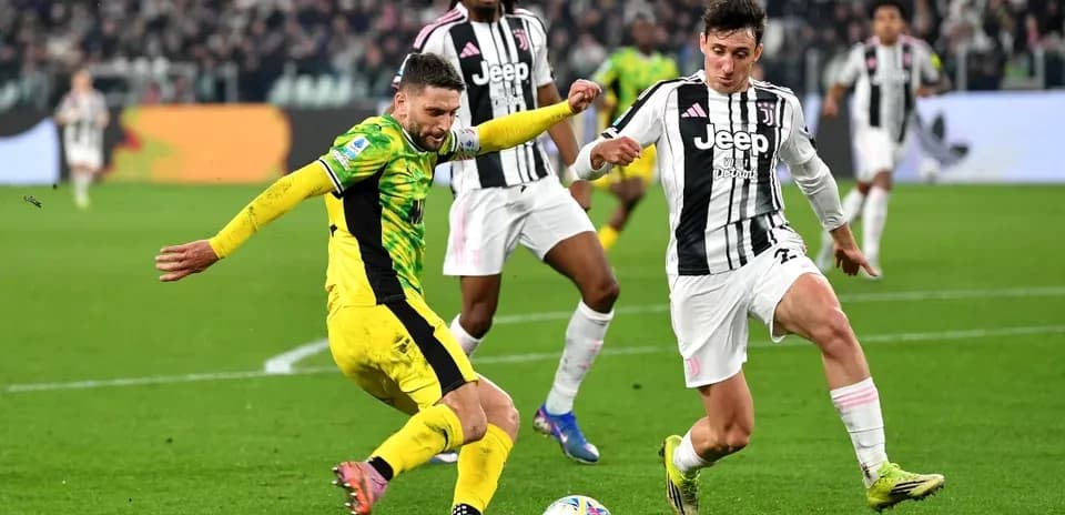 Player tackling opponent during Juventus match