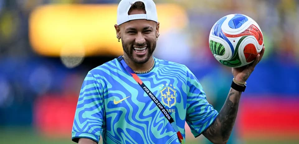 Player holding a soccer ball during warm-up