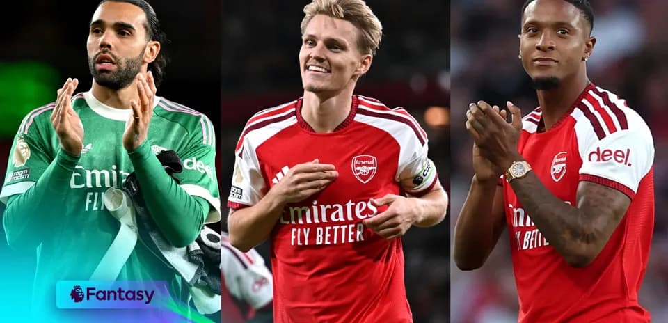 Three Arsenal players applauding fans after match