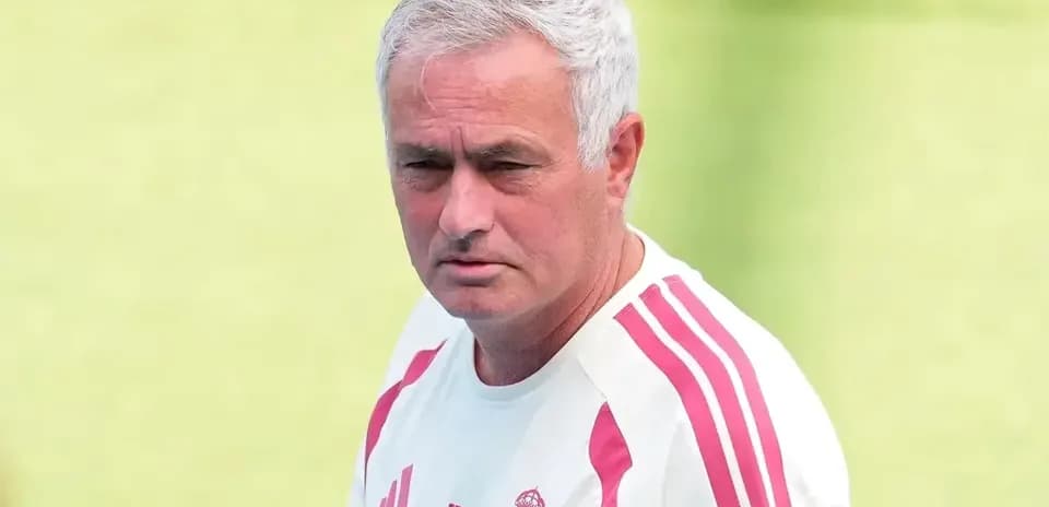Coach observing players during training session