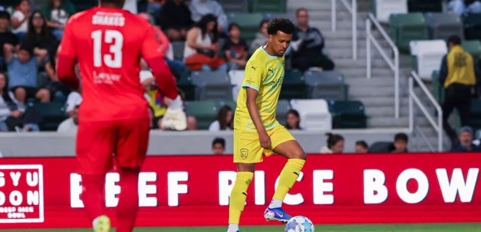 Player preparing to kick the ball during match