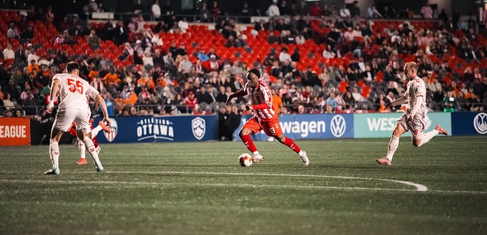 Player dribbling the ball during Ottawa vs Cavalry match