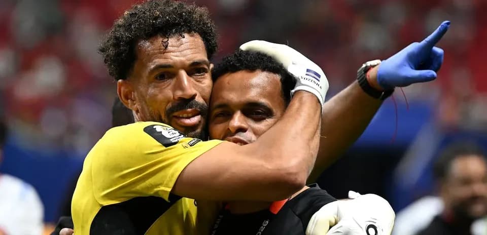 Goalkeeper celebrating with staff after match