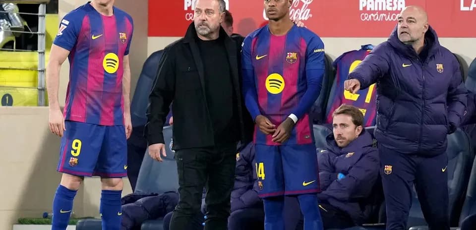 Barcelona players and staff during a match substitution