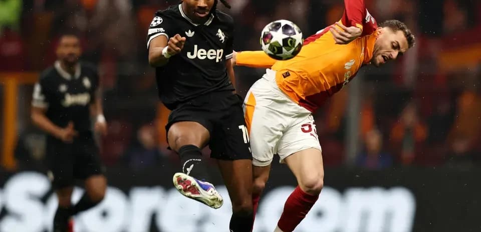 Two players contesting the ball during a match