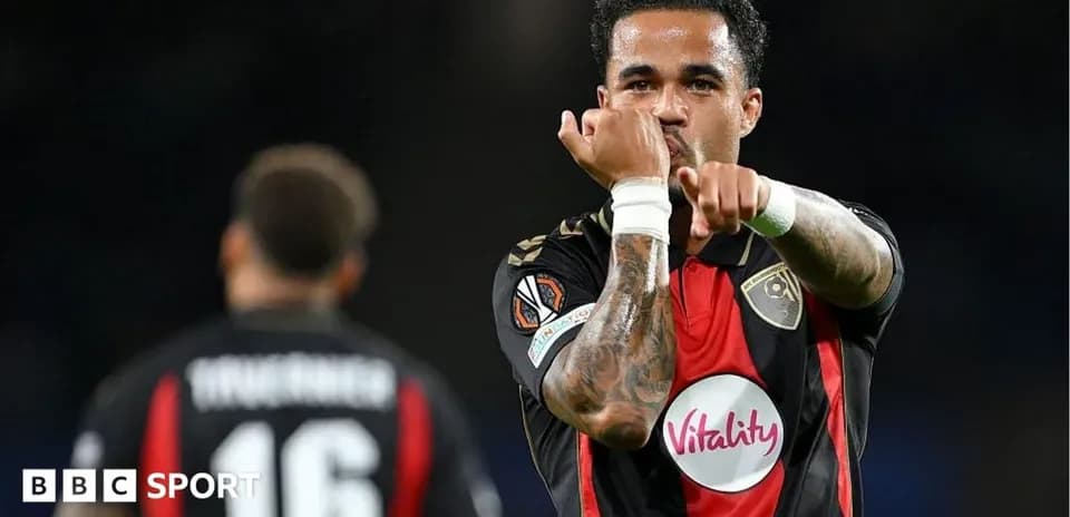 Player gesturing during match with teammate in background