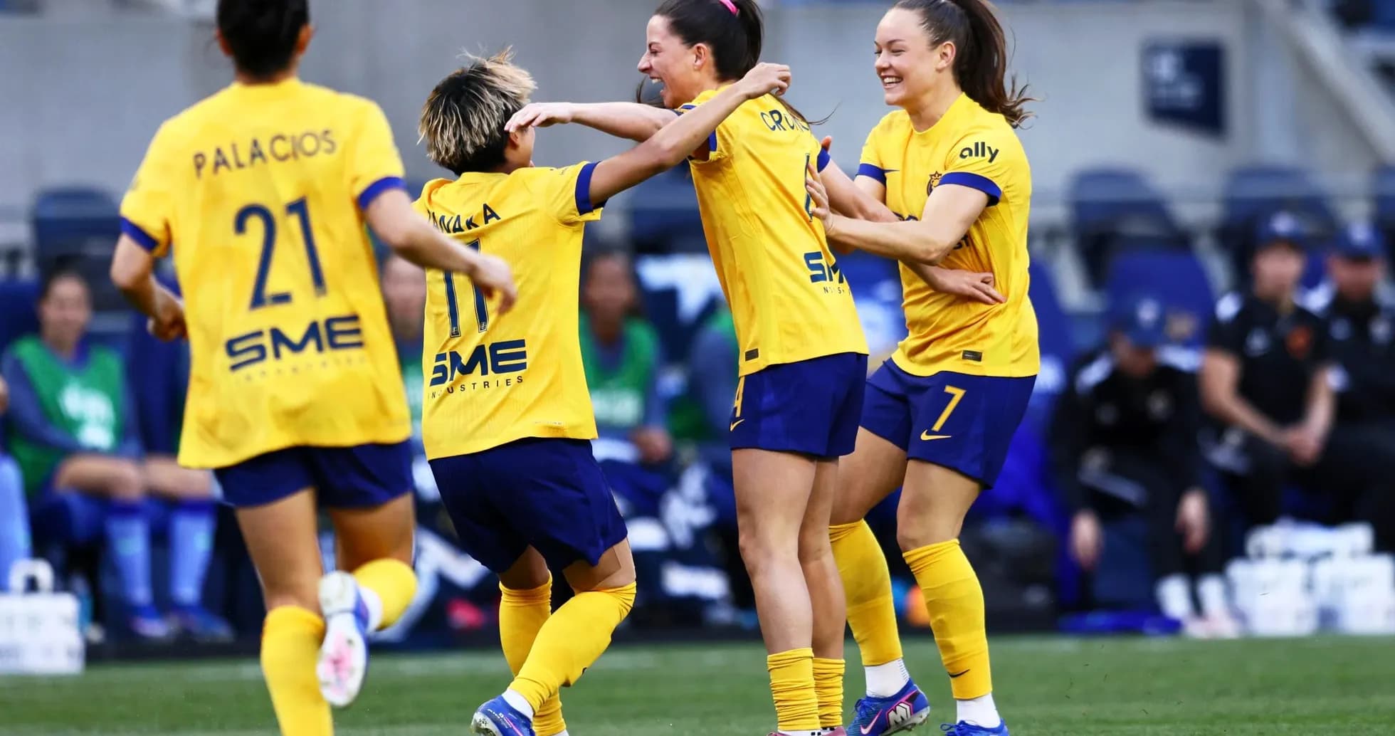 Players celebrating a goal during NWSL match