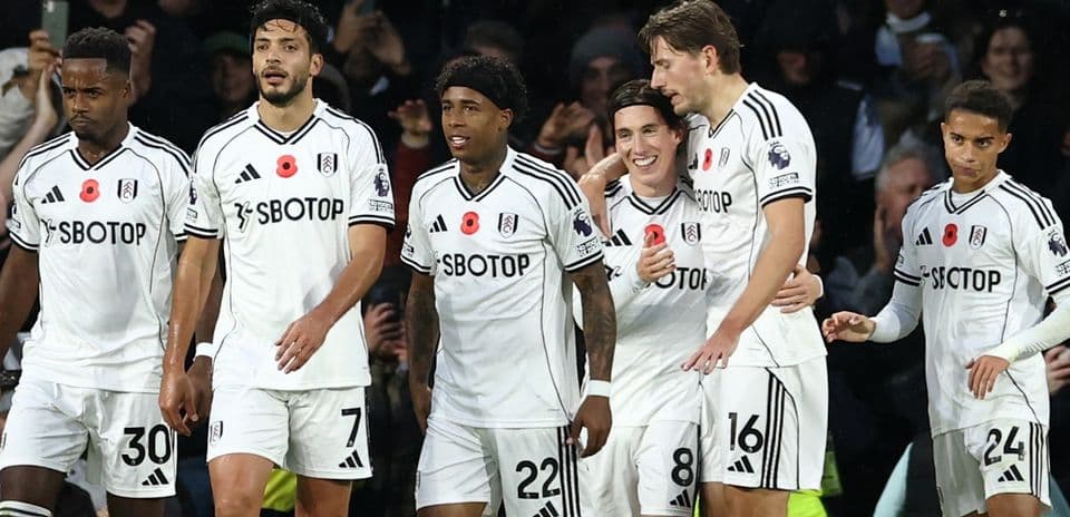 Fulham players celebrating a goal during match