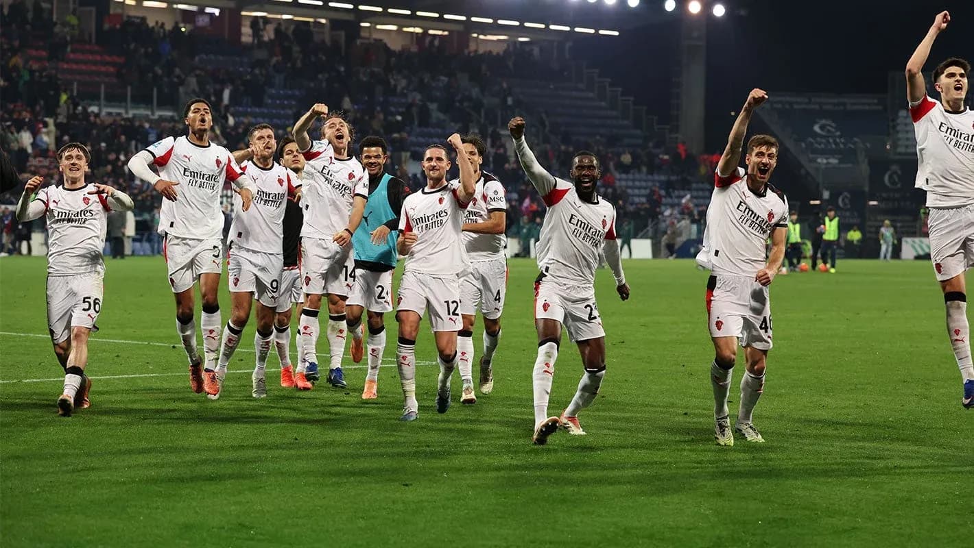 AC Milan players celebrating victory on the field