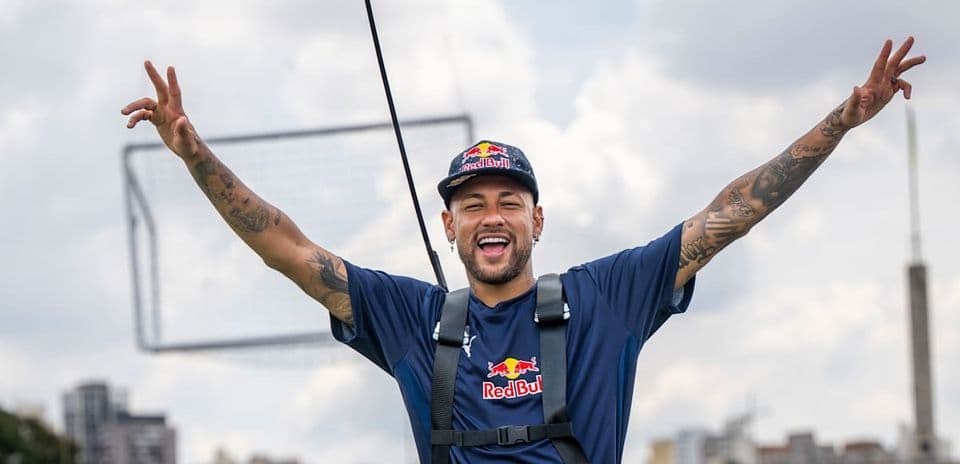 Neymar celebrating in a Red Bull event outdoors