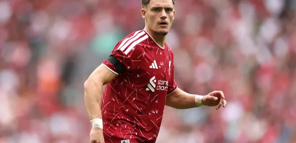 Player in red kit during football match