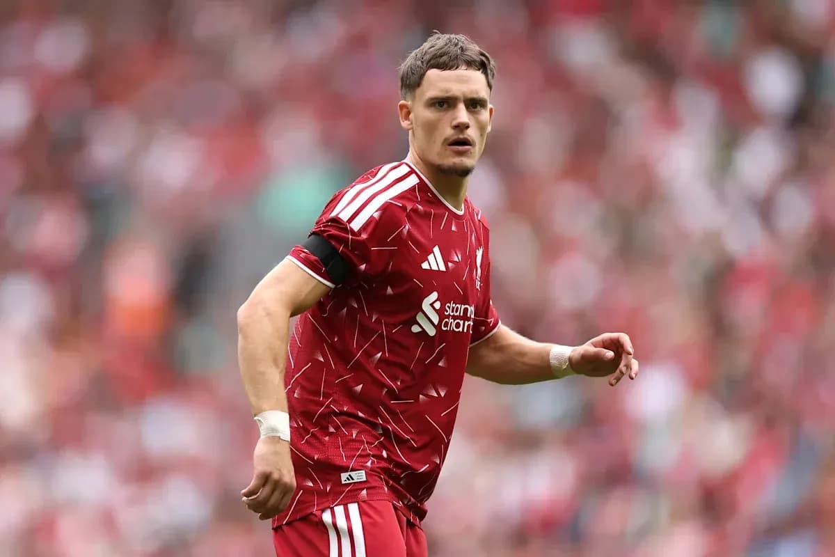 Player in red kit during football match