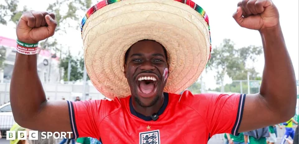 Fan celebrating in England jersey and sombrero