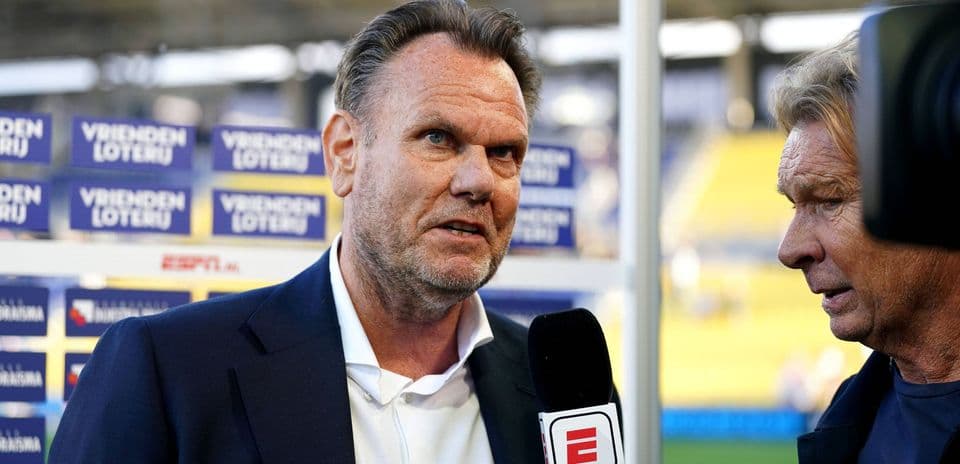 Man being interviewed before a sports event