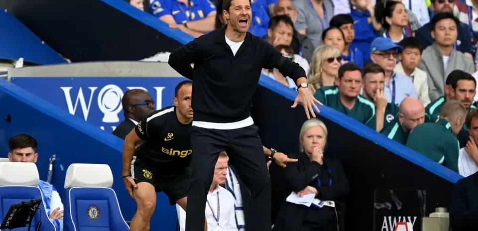 Coach directing players from the sidelines during match