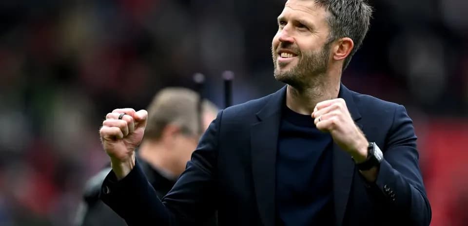 Manager celebrating enthusiastically after a match
