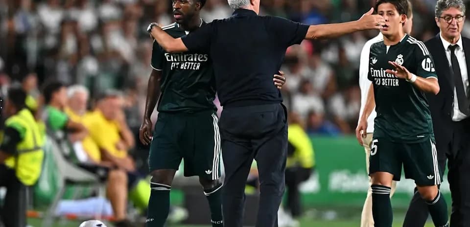 Manager giving instructions to players during match