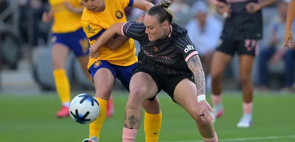 Players competing for the ball during match