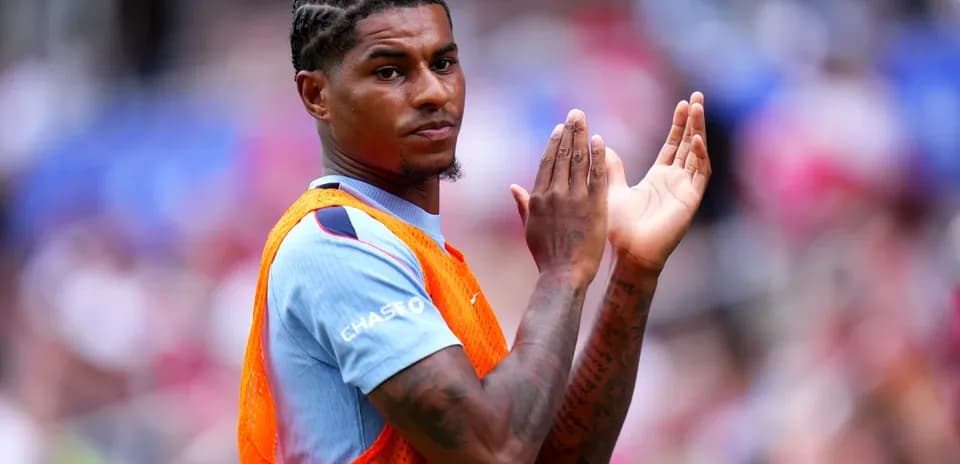 Player applauding from the sidelines during match