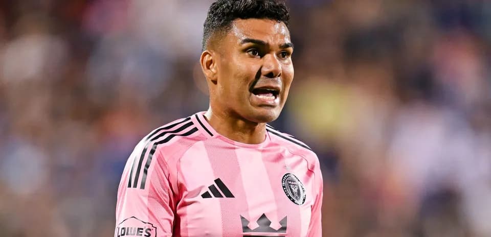 Player in pink jersey shouting during match