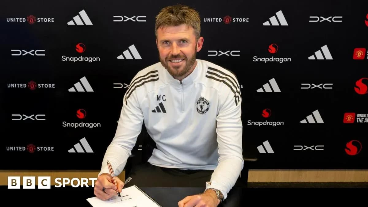 Coach signing contract at Manchester United press event