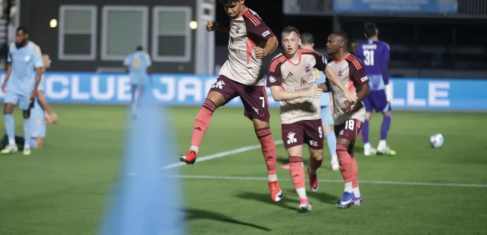 Player celebrating goal during Sporting JAX match