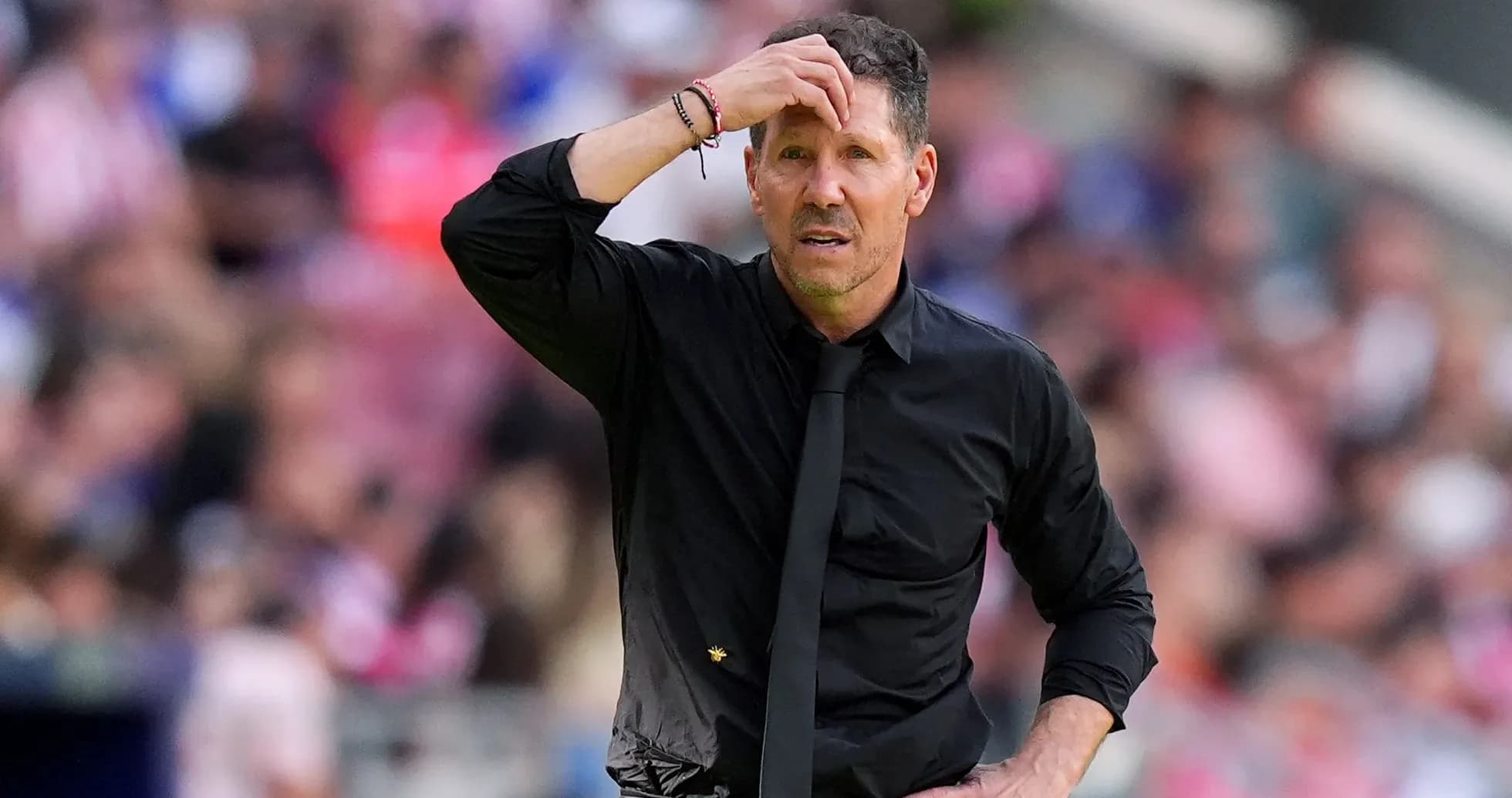 Coach looking concerned during a match on sideline