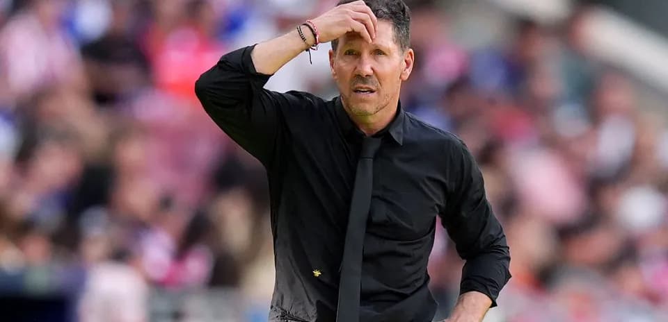 Coach looking concerned during a match on sideline