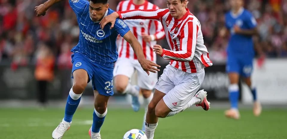 Two players contesting the ball during a match
