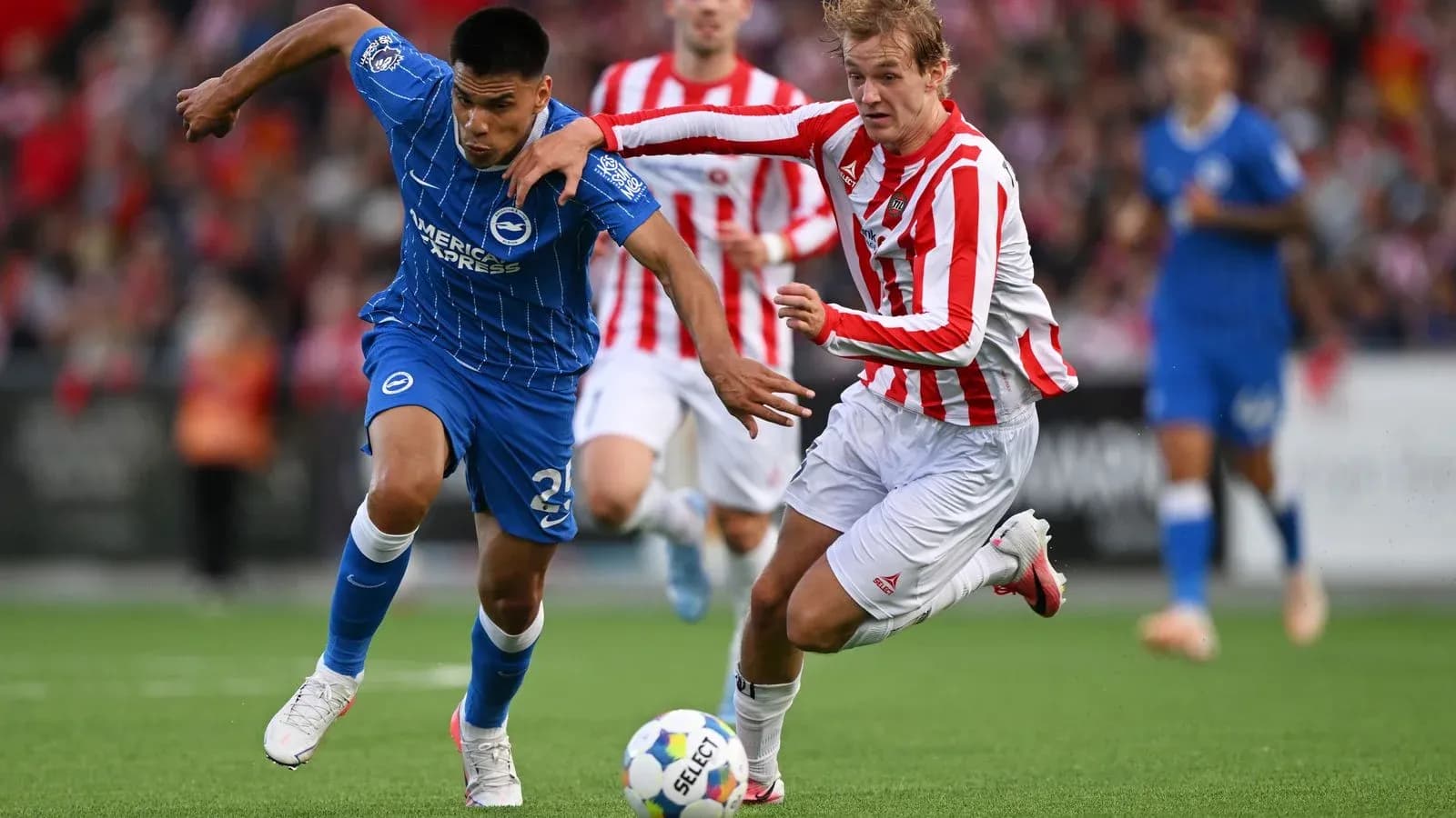Two players contesting the ball during a match