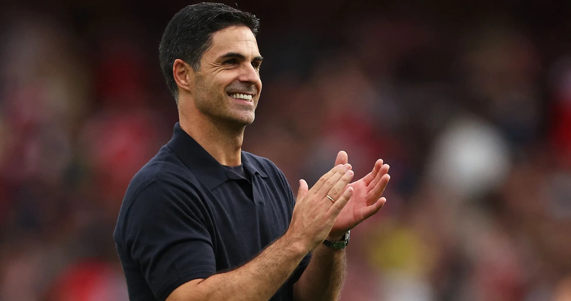 Coach applauding during a match celebration
